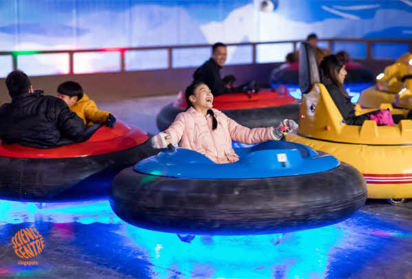 People enjoying the bumper car ride