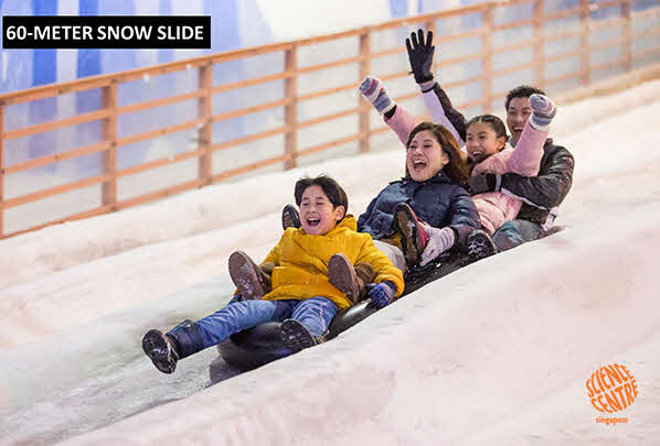 A family enjoying the snow slope