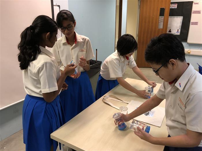 Students preparing their sales items at Regent Secondary School